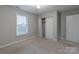 Neutral bedroom featuring a window, ceiling fan, and closet at 133 Pheasant Run Rd, Troutman, NC 28166