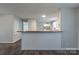Breakfast bar overlooking kitchen and laundry area, featuring a wooden countertop and wainscoting at 133 Pheasant Run Rd, Troutman, NC 28166