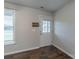 Entryway featuring dark wood floors, coat hooks, and a light-filled window at 133 Pheasant Run Rd, Troutman, NC 28166