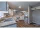 Spacious kitchen featuring stainless steel appliances, breakfast bar and open access to the living area with natural light at 133 Pheasant Run Rd, Troutman, NC 28166