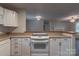 Open kitchen layout features an electric cooktop, breakfast bar, and seamless flow into the living area for entertaining at 133 Pheasant Run Rd, Troutman, NC 28166