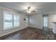 Living room featuring hardwood floors, a ceiling fan, and a bright window, creating a welcoming atmosphere at 133 Pheasant Run Rd, Troutman, NC 28166