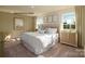 Inviting bedroom featuring a large bed with a tufted headboard and coordinated decor at 1338 37Th Avenue Ne Ln, Hickory, NC 28601