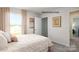 Comfortable bedroom showcasing a closet, large window with curtains, and soft color palette at 1338 37Th Avenue Ne Ln, Hickory, NC 28601