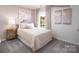 Comfortable bedroom with neutral tones, carpet, and an abundance of natural light at 1338 37Th Avenue Ne Ln, Hickory, NC 28601