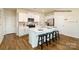 Spacious kitchen featuring white cabinets, stainless steel appliances, and hardwood floors at 1338 37Th Avenue Ne Ln, Hickory, NC 28601