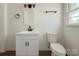 Modern bathroom boasts a new vanity, sleek black hardware, and a comfort height toilet at 1401 Woodman Hall St, Shelby, NC 28152