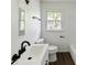 Modern bathroom with a sleek vanity, updated fixtures, and a combined tub and shower at 1401 Woodman Hall St, Shelby, NC 28152