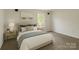 Comfortable bedroom with neutral tones, carpet, and natural light from a window at 1401 Woodman Hall St, Shelby, NC 28152