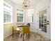 Cozy breakfast nook filled with light, featuring a table and chairs near a door at 14336 Northridge Dr, Charlotte, NC 28269