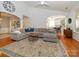 Spacious living room with hardwood floors, an area rug, and an open layout to the kitchen at 14336 Northridge Dr, Charlotte, NC 28269