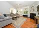 Bright living room features vaulted ceilings, a fireplace, and windows providing natural light at 14336 Northridge Dr, Charlotte, NC 28269