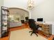 Spacious home office adjacent to a living room with abundant natural light and hardwood floors at 14336 Northridge Dr, Charlotte, NC 28269