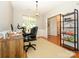 Bright home office space with desk, chair, shelving and views of the front yard at 14336 Northridge Dr, Charlotte, NC 28269