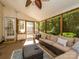 Relaxing sunroom with comfortable seating, outdoor views, and a ceiling fan, perfect for enjoying the outdoors indoors at 14336 Northridge Dr, Charlotte, NC 28269
