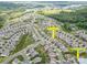 An aerial view showcases the neighborhood layout, property location, and nearby amenities like a community pool and ponds at 145 Yellow Birch Loop, Mooresville, NC 28117