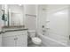 Clean bathroom with a shower and bathtub combo, complemented by a granite sink top at 145 Yellow Birch Loop, Mooresville, NC 28117