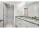 Bathroom with a granite countertop vanity, double sinks, modern fixtures, and tub with shower at 145 Yellow Birch Loop, Mooresville, NC 28117