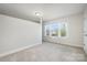 Comfortable bedroom featuring neutral carpet and a window providing natural light at 145 Yellow Birch Loop, Mooresville, NC 28117
