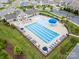 A birds eye view of the community pool and recreational area, surrounded by neat landscaping and lounge chairs at 145 Yellow Birch Loop, Mooresville, NC 28117
