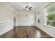 Bright dining room boasts hardwood floors, wainscoting and large windows at 145 Yellow Birch Loop, Mooresville, NC 28117