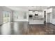Open kitchen and dining area with stainless steel appliances, granite counters, and sliding glass doors at 145 Yellow Birch Loop, Mooresville, NC 28117