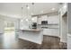 Modern eat-in kitchen features granite countertops, stainless appliances, and natural light at 145 Yellow Birch Loop, Mooresville, NC 28117