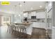Modern eat-in kitchen features granite countertops, stainless appliances, and bar stool seating at 145 Yellow Birch Loop, Mooresville, NC 28117