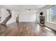 Spacious living room featuring hardwood floors, a fireplace, and lots of natural light at 145 Yellow Birch Loop, Mooresville, NC 28117