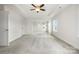 Large, carpeted main bedroom with a tray ceiling and large windows at 145 Yellow Birch Loop, Mooresville, NC 28117