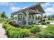 Charming community pavilion that includes picnic tables and outdoor grill, nestled among vibrant flowerbeds and manicured lawns at 145 Yellow Birch Loop, Mooresville, NC 28117
