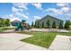 Community playground with slides, swings, and lush green surroundings at 145 Yellow Birch Loop, Mooresville, NC 28117
