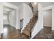 Carpeted staircase with iron railing at 145 Yellow Birch Loop, Mooresville, NC 28117