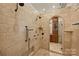 Luxury bathroom featuring multiple shower heads and beautiful tile work at 16909 Jetton Rd, Cornelius, NC 28031