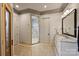 Bathroom with tiled floor, walk-in glass shower, granite vanity and mirror at 16909 Jetton Rd, Cornelius, NC 28031