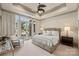 Bright bedroom featuring patio access, a trey ceiling, and neutral tones at 16909 Jetton Rd, Cornelius, NC 28031