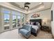 Bright bedroom featuring trey ceiling, patio access, and neutral-toned furnishings at 16909 Jetton Rd, Cornelius, NC 28031
