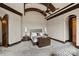 Comfortable bedroom with neutral color palate and tray ceiling at 16909 Jetton Rd, Cornelius, NC 28031