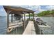 Covered boat dock with boat and jet ski lifts, providing convenient access to the lake for water activities at 16909 Jetton Rd, Cornelius, NC 28031