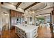 Bright kitchen island with custom cabinets, pendant lights, and lake views in an open floorplan at 16909 Jetton Rd, Cornelius, NC 28031