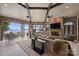 Bright living room with a stone fireplace, lake views, and an open layout at 16909 Jetton Rd, Cornelius, NC 28031