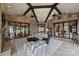 Expansive living room with stone accents, bright windows, and seamless indoor/outdoor transitions at 16909 Jetton Rd, Cornelius, NC 28031