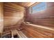 Wood paneled sauna features a window and wood benches at 16909 Jetton Rd, Cornelius, NC 28031