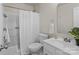 Well-lit bathroom featuring shower-tub, toilet, sink, mirror and wood-look flooring at 1961 Leesburg Dr, Clover, SC 29710