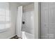 Clean bathroom with a shower-tub, white curtain, and built in shelving for toiletries and decorations at 1961 Leesburg Dr, Clover, SC 29710