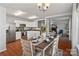 Open dining area with wood floors and a view into the kitchen and living room at 1961 Leesburg Dr, Clover, SC 29710