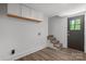 Finished basement area with stair access to the main level at 218 Kingsway Cir, Charlotte, NC 28214