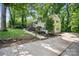 Exterior angle showing a home's side, dark trim and fresh landscaping at 218 Kingsway Cir, Charlotte, NC 28214