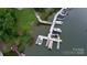 Aerial shot of docks with multiple boats along a waterfront property at 26056 Neptunes Lndg, Fort Mill, SC 29708