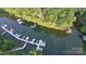 An aerial view of a waterfront with docks and multiple boats parked at 26056 Neptunes Lndg, Fort Mill, SC 29708